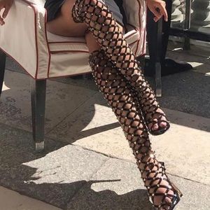 Thigh high patent boots